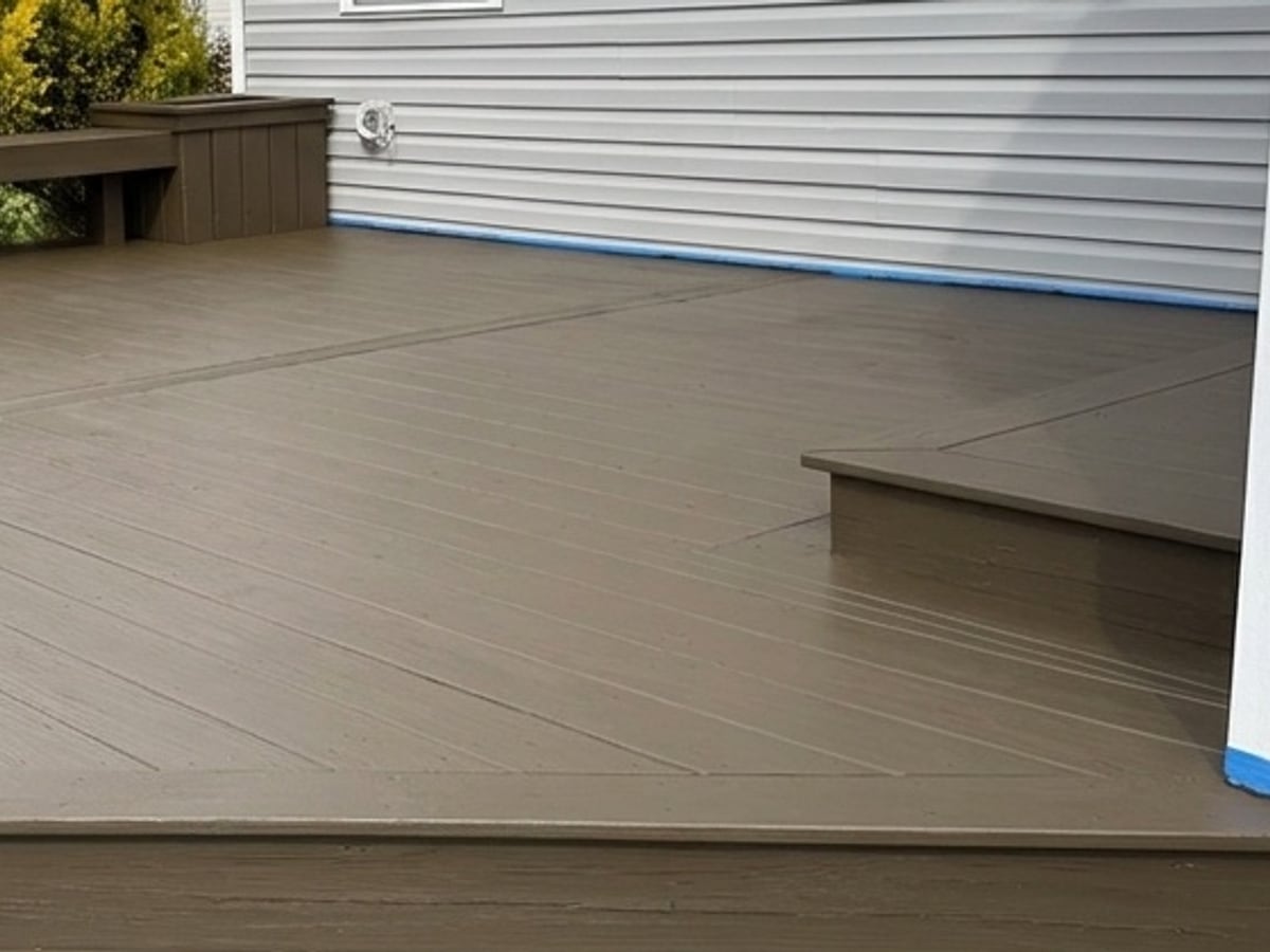 After, the same deck stripped, cleaned and restained a warm clean brown by Core Exterior Services