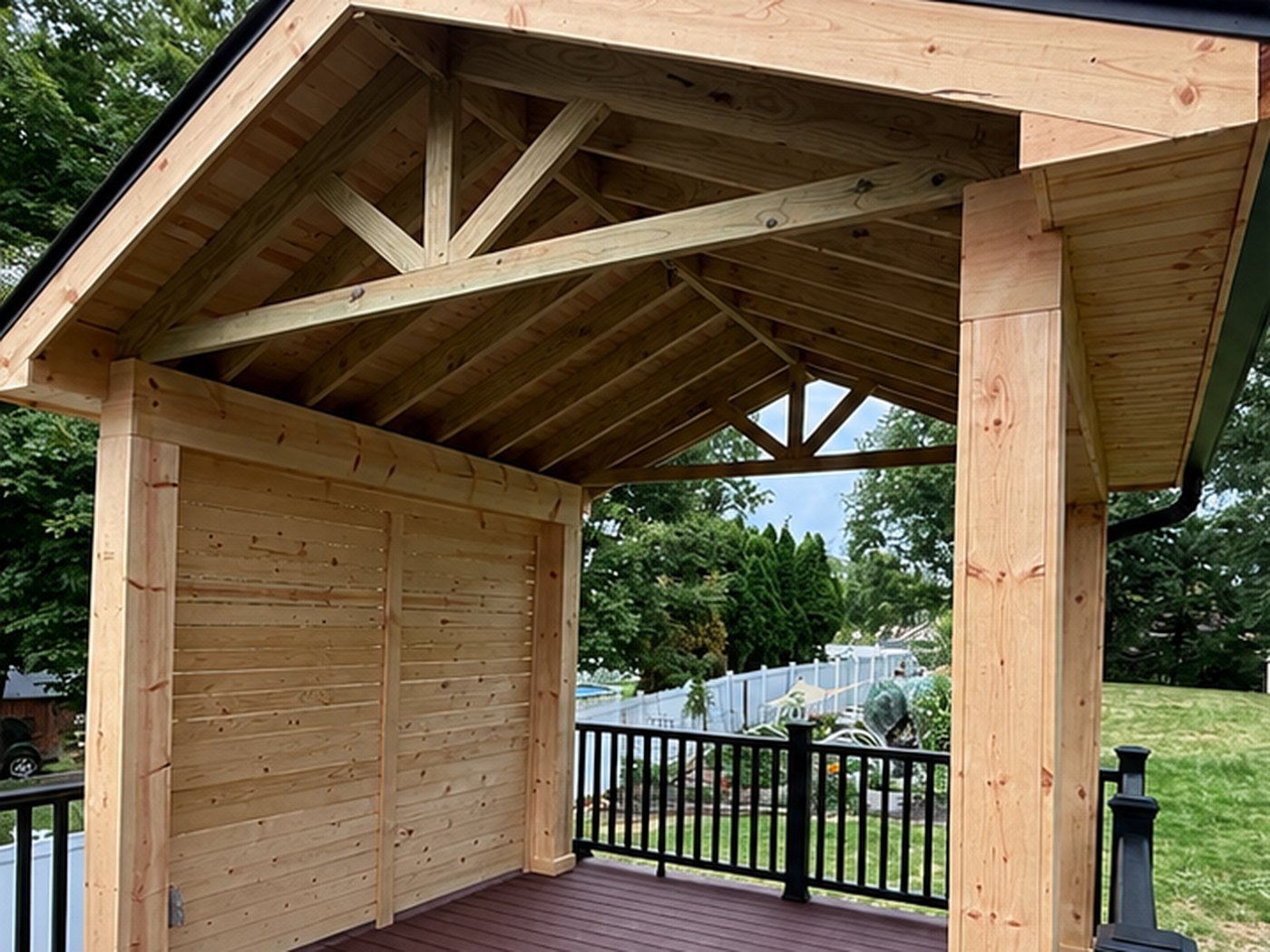 Before, a backyard pavilion in bare untreated pine, greying and unsealed