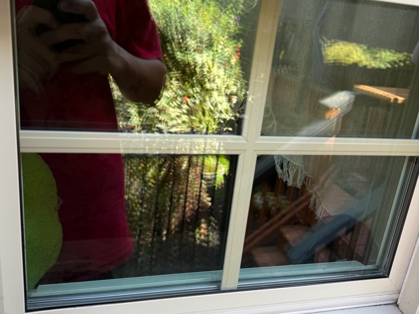 After, the same window washed clear with a clean sill and frame by Core Exterior Services