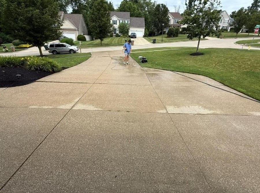 A concrete driveway washed clean by Core Exterior Services