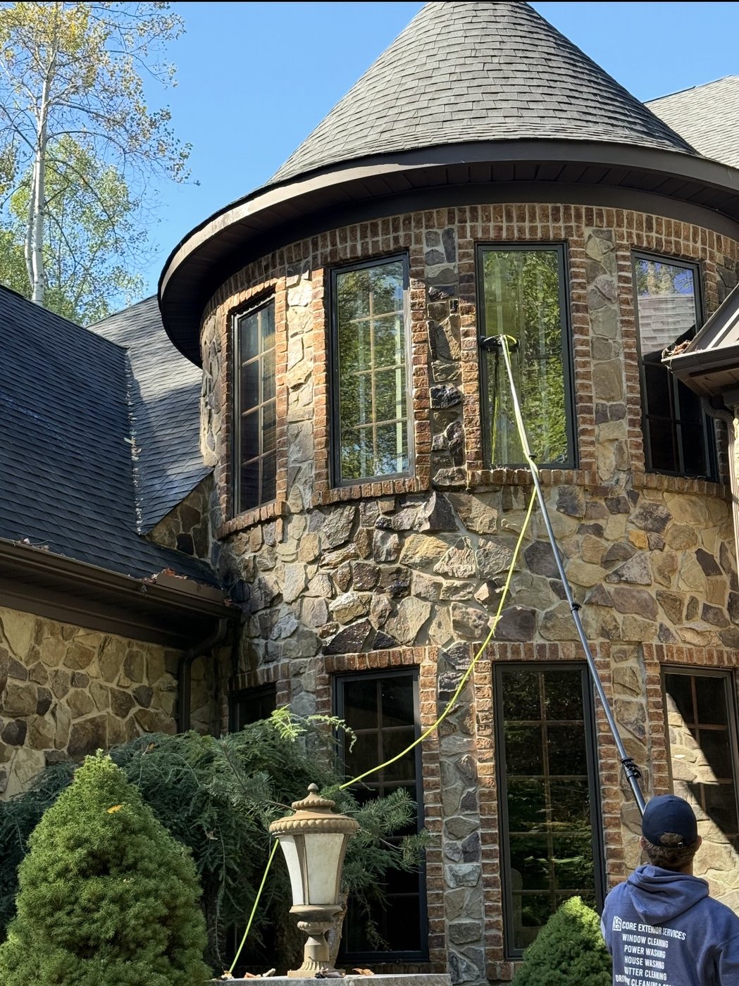A stone home turret cleaned by Core Exterior Services